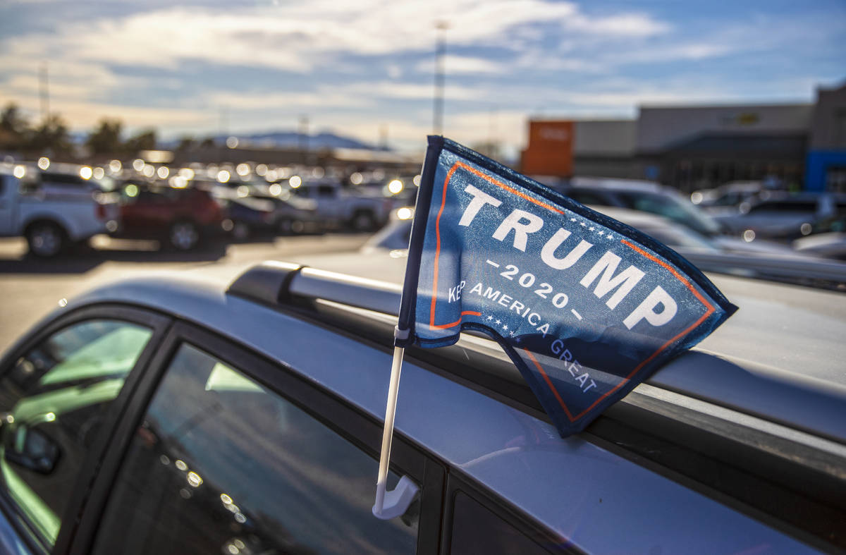 A supporter of President Trump is parked outside Walmart Supercenter on Monday, Jan. 11, 2021, ...