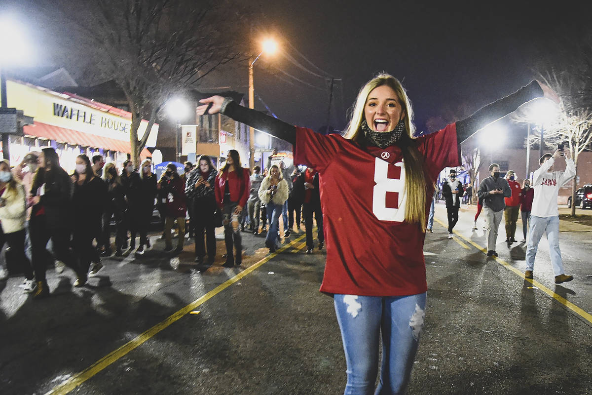 Alabama fans celebrate in the street in Tuscaloosa, Ala., Monday night, Jan. 11, 2021, after Al ...