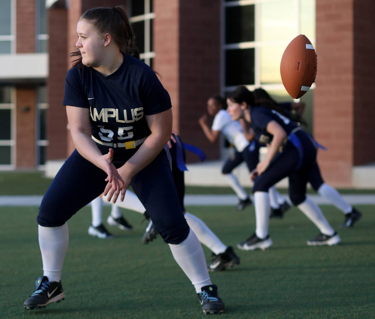 Amplus High School flag football center Rilee Rambow (55) hikes the ball during practice at Amp ...