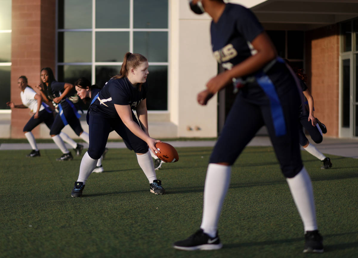 Amplus High School flag football center Rilee Rambow (55) hikes the ball during practice at Amp ...