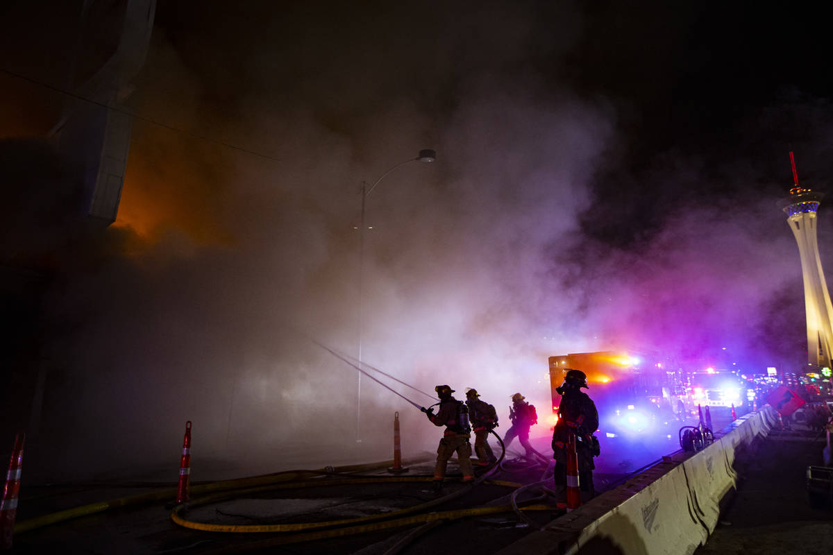Las Vegas firefighters battle flames engulfing a vacant wedding chapel at 1431 S. Las Vegas Blv ...