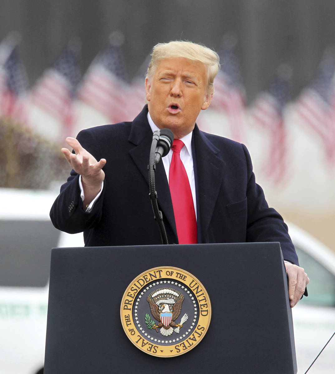 President Donald Trump speaks near a section of the U.S.-Mexico border wall, Tuesday, Jan. 12, ...