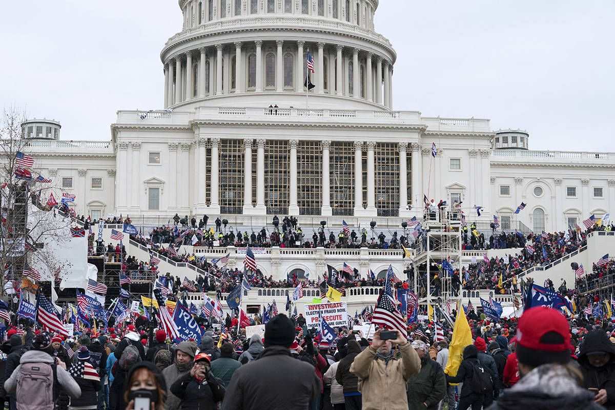 Trump supporters gather outside the Capitol on Wednesday, Jan. 6, 2021, in Washington. As Congr ...