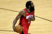 Houston Rockets' James Harden controls the ball during the first quarter of an NBA basketball g ...