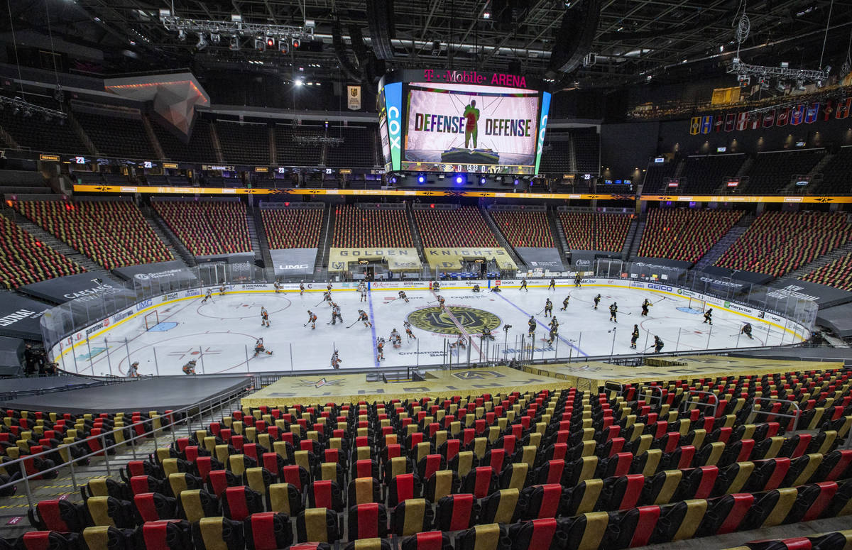 Golden Knights and Anaheim Ducks players take the ice during the warm ups of an NHL season-open ...