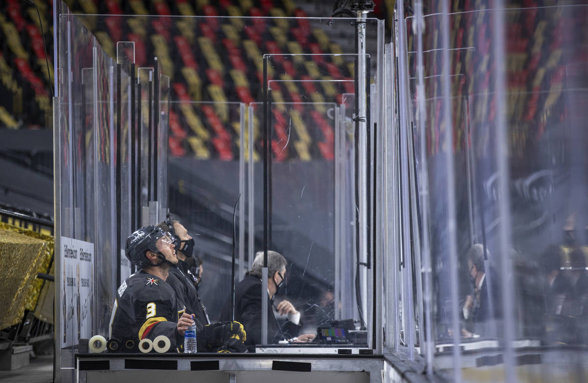 Golden Knights defenseman Brayden McNabb (3) looks to the display from the penalty box versus t ...