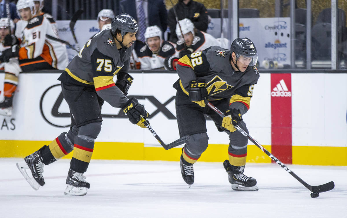 Golden Knights right wing Tomas Jurco (92) drives to the net with teammate Golden Knights right ...