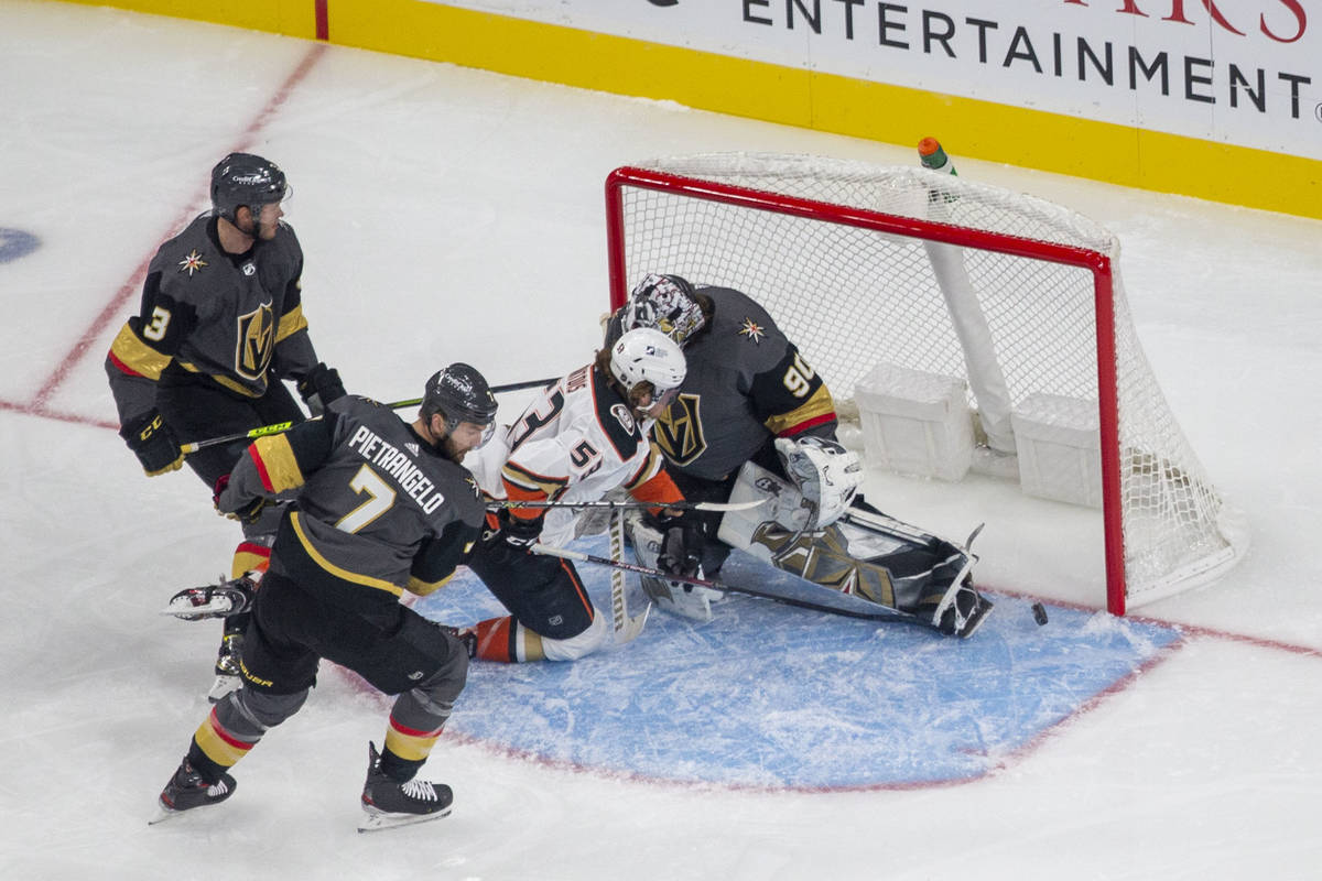 Vegas Golden Knights defensemen Alex Pietrangelo (7) and Brayden McNabb (3) look on as Anaheim ...