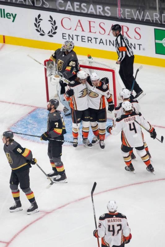 Anaheim Ducks defenseman Cam Fowler (4) skates in to congratulate forward Max Comtois (53) on h ...