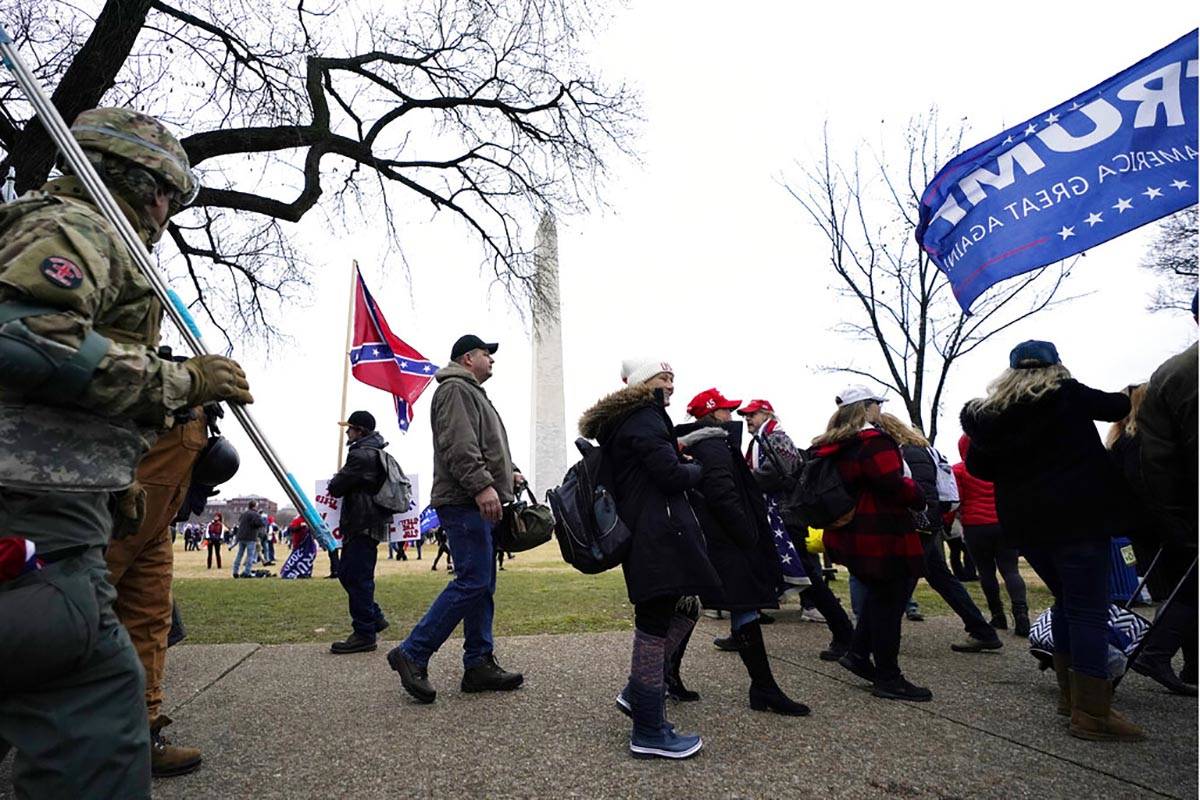 In this Jan. 6, 2021, file photo, Trump supporters gather on the Washington Monument grounds in ...