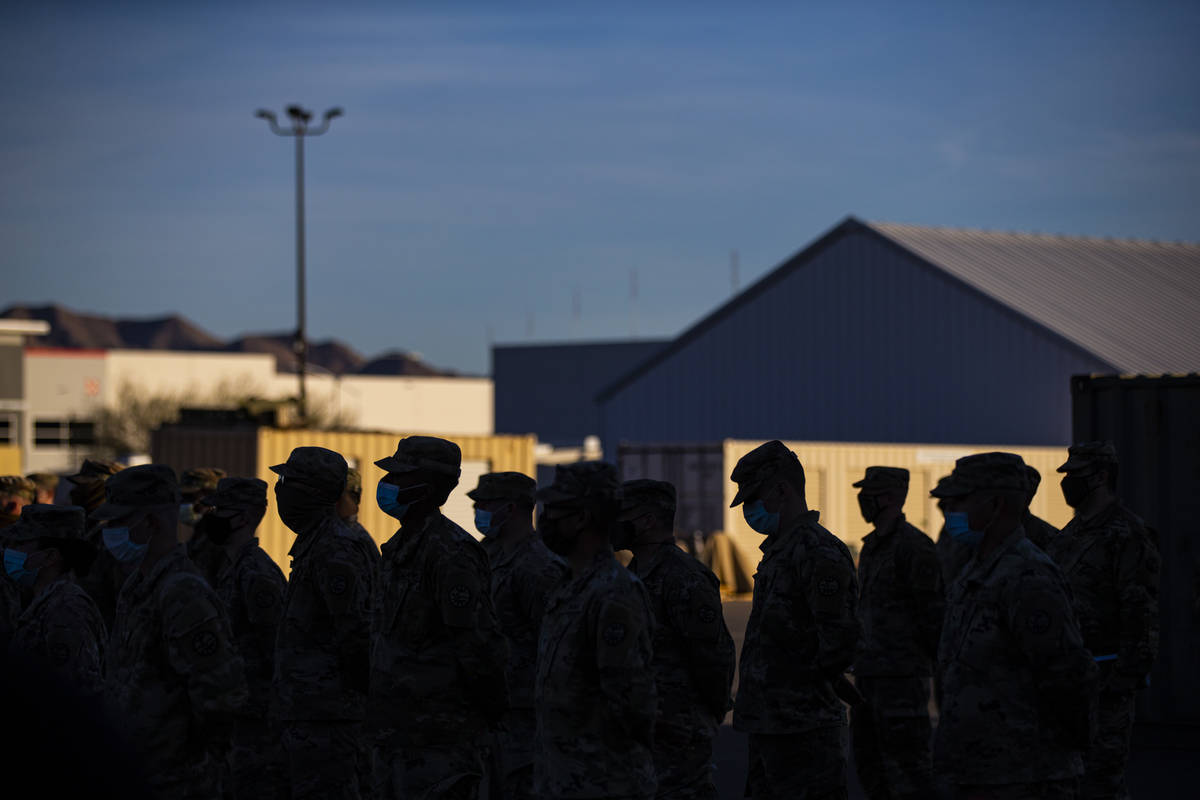 Members of the Nevada Army Guard listen to Maj. Gen. Ondra Berry, not pictured, on Thursday, Ja ...