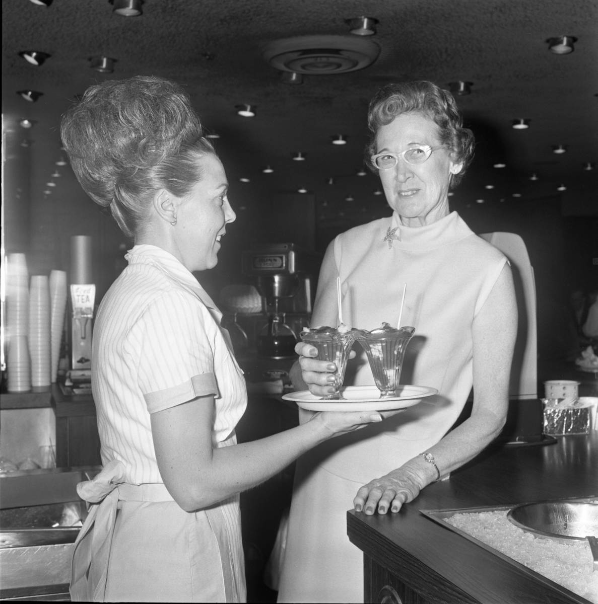 Waitress Gladys Reed, left, and Johnnie Wilson holding the famous Golden Gate shrimp cocktail i ...