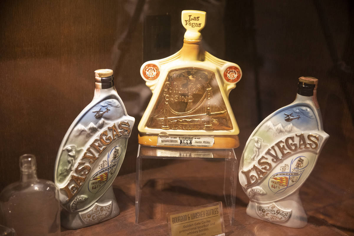 Bourbon and whiskey bottles from the 1950s are displayed at Golden Gate hotel-casino in Las Ve ...