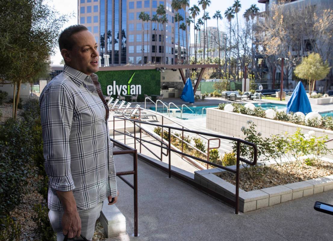 Eric Cohen, cofounder of The Calida Group, leads a tour of Elysian at Hughes Center, an apartme ...