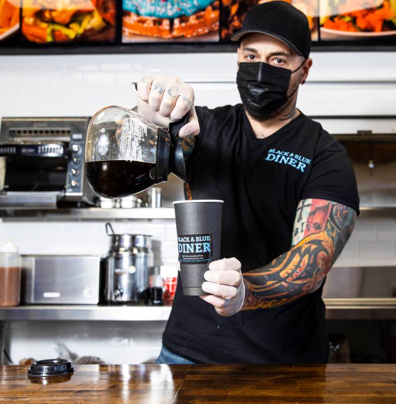 Chef Vic Vegas pours a cup of coffee at his new Black & Blue Diner, which opens Monday at 315 S ...