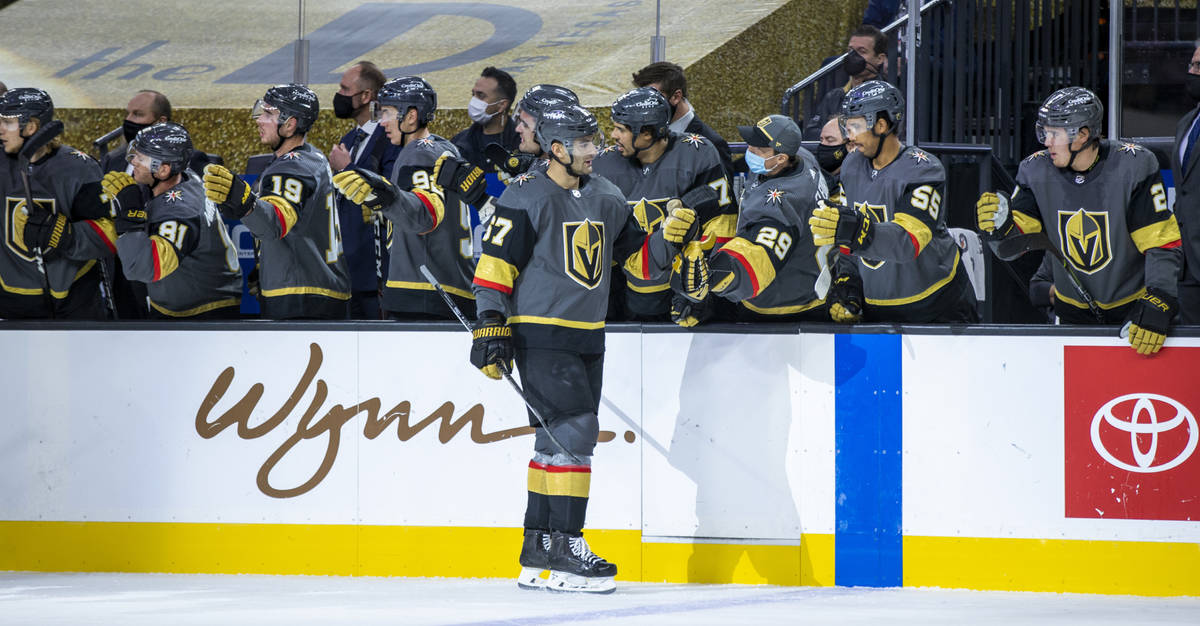 Golden Knights left wing Max Pacioretty (67) is congratulated on his goal by teammates versus t ...