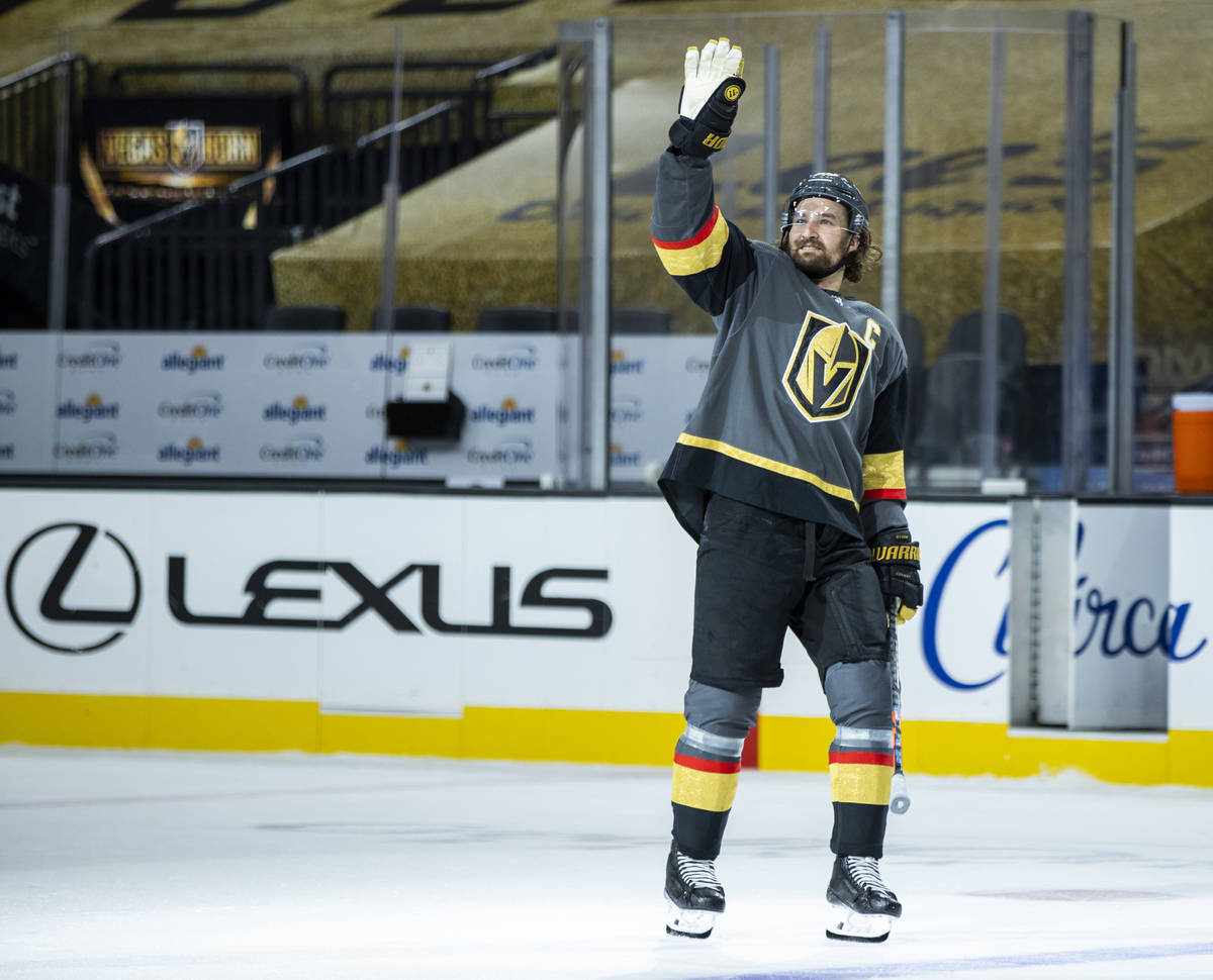 Golden Knights right wing Mark Stone (61) waves thanks to the empty seats after their 5-2 win o ...