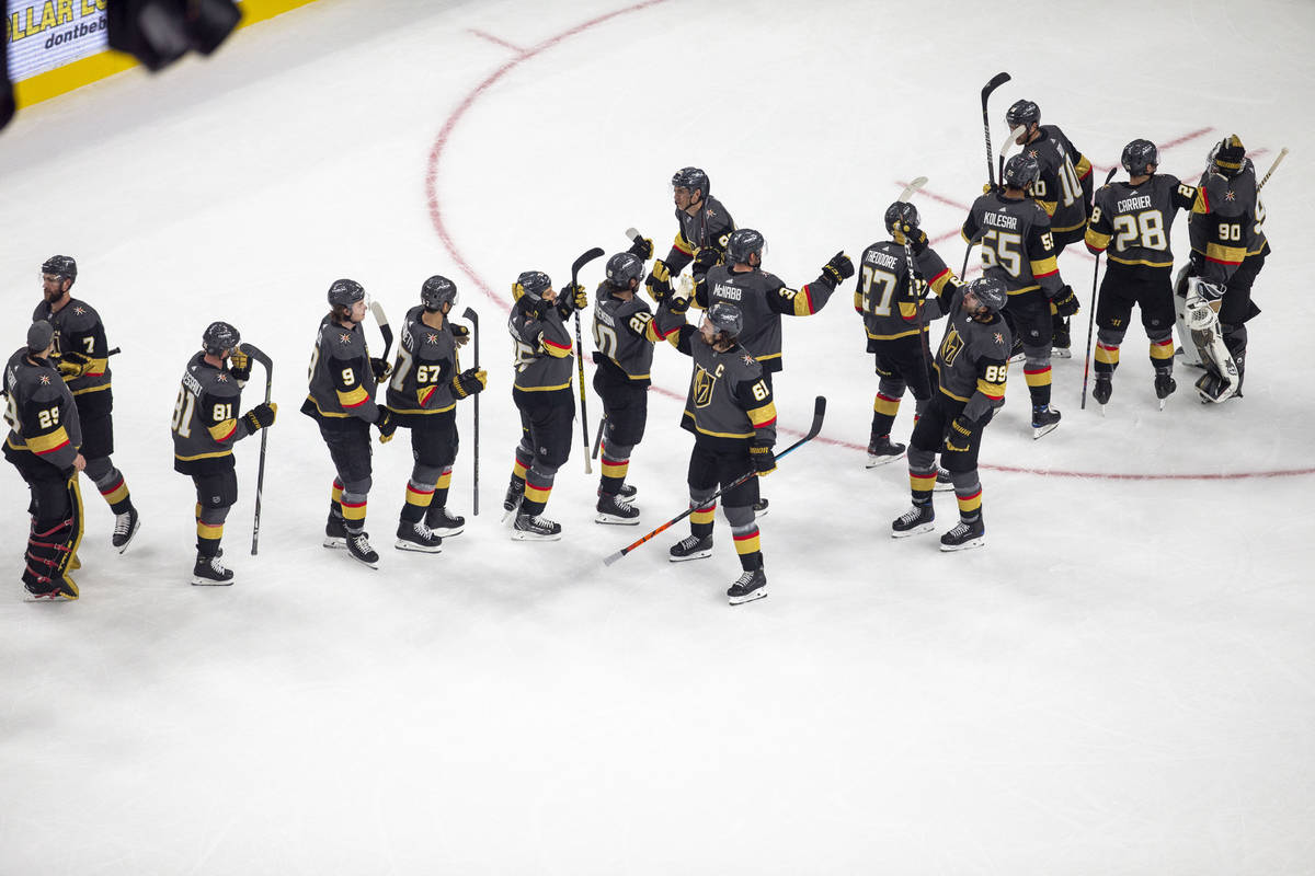 Vegas Golden Knights congratulate each other after a 5-2 win over the Anaheim Ducks during an N ...