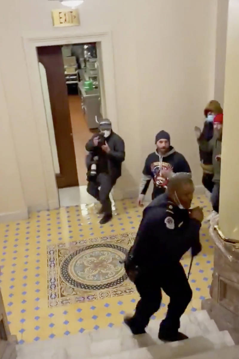 In this image made from video and provided by HuffPost, Capitol Police Officer Eugene Goodman c ...