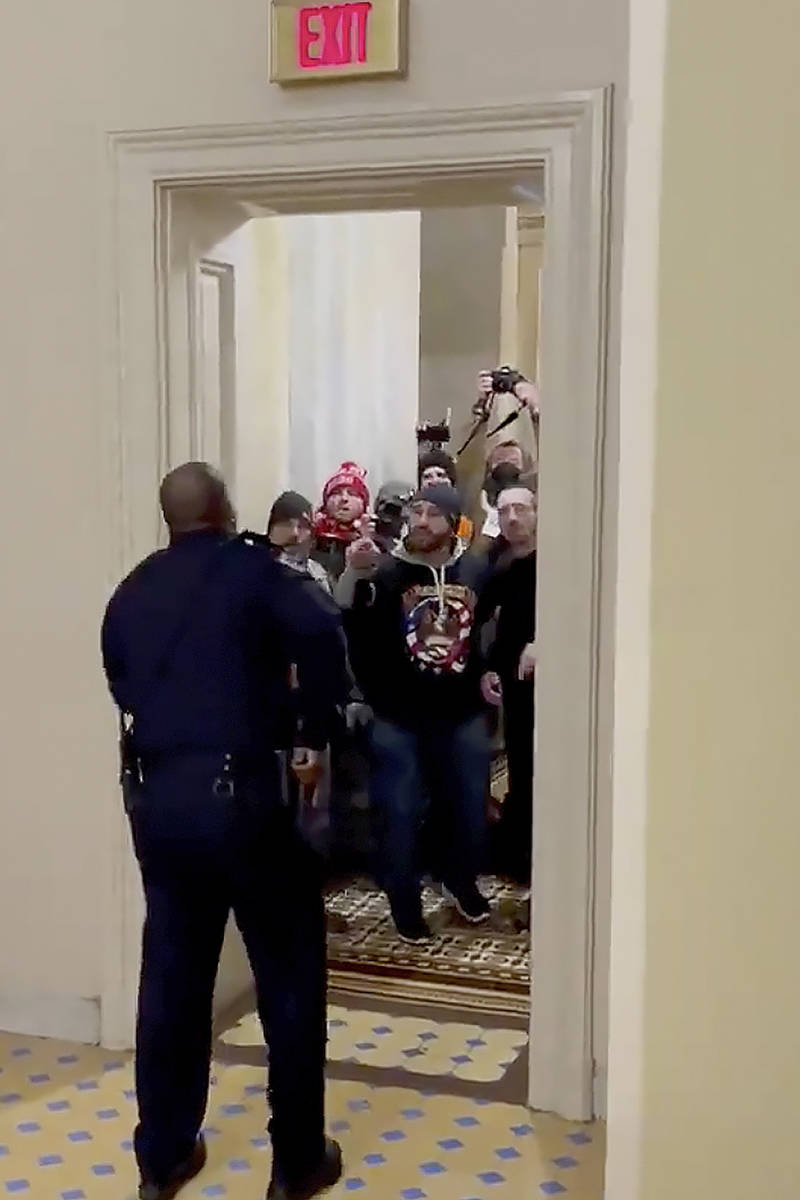 In this image made from video and provided by HuffPost, Capitol Police Officer Eugene Goodman s ...