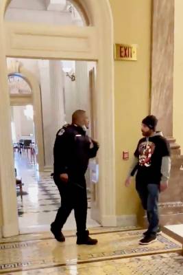 In this image made from video and provided by HuffPost, Capitol Police Officer Eugene Goodman c ...