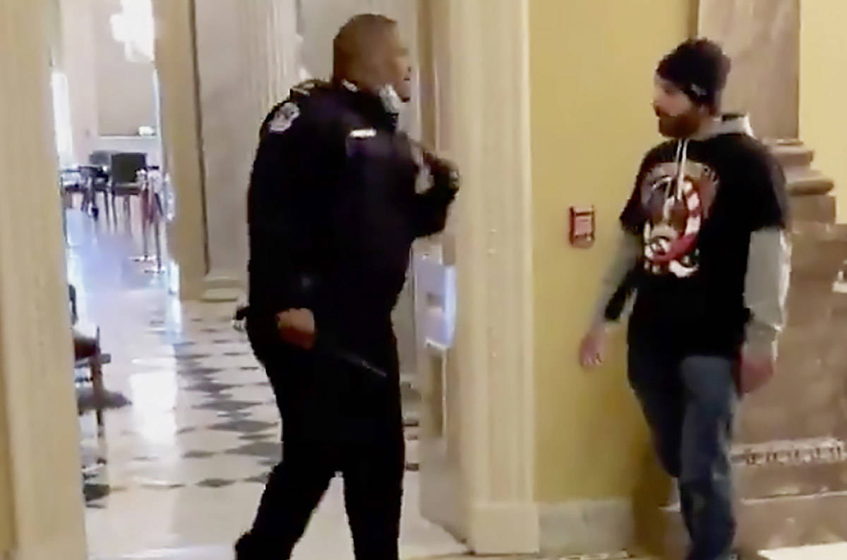 In an image made from video and provided by HuffPost, Capitol Police Officer Eugene Goodman cal ...