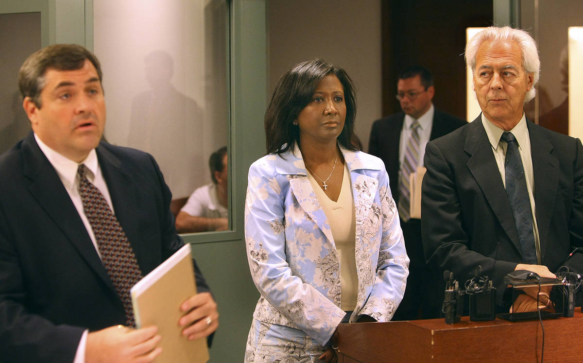 Former County Commissioner Lynette Boggs appears in court with public defender Daren Richard, r ...