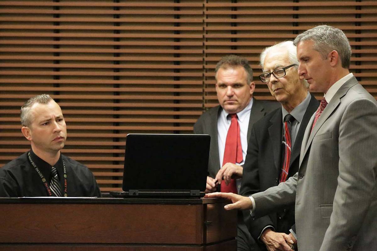 Henderson police Detective Wayne Nichols, seated, and defense attorneys Keith Brower and Bill T ...