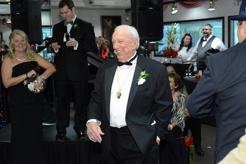 Tower of Jewels founder and owner Jack Weinstein (center) throws the annual 2012 holiday party ...