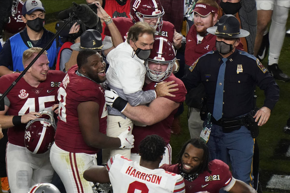 Players celebrate with Alabama head coach Nick Saban after their win against Ohio State in an N ...