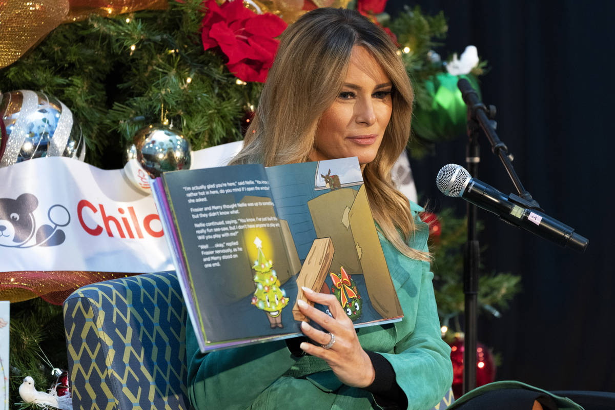 First lady Melania Trump reads a Christmas book to children who are patients at Children's Nati ...