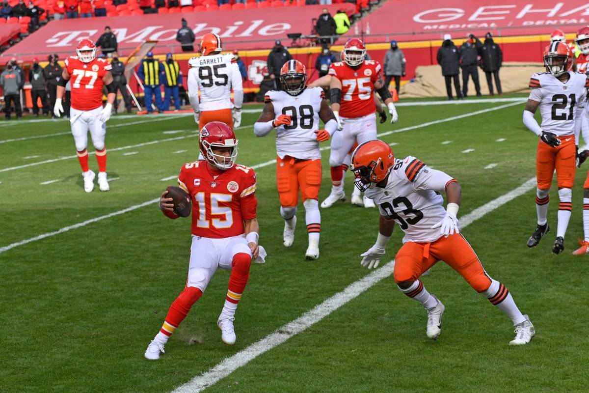 Kansas City Chiefs quarterback Patrick Mahomes (15) scores on a touchdown run during the first ...