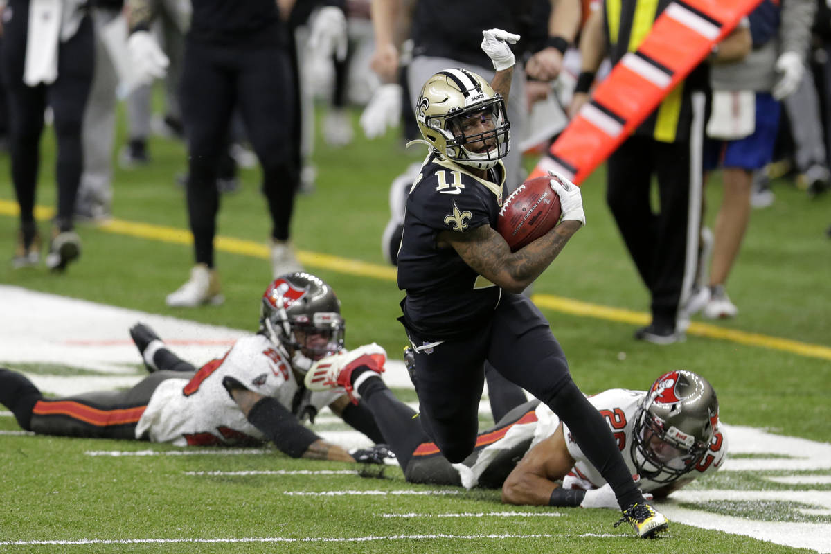 New Orleans Saints' Deonte Harris (11) runs back a punt against the Tampa Bay Buccaneers during ...