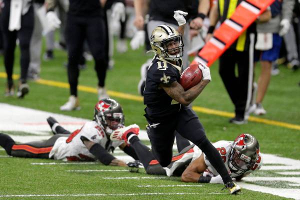 New Orleans Saints' Deonte Harris (11) runs back a punt against the Tampa Bay Buccaneers during ...