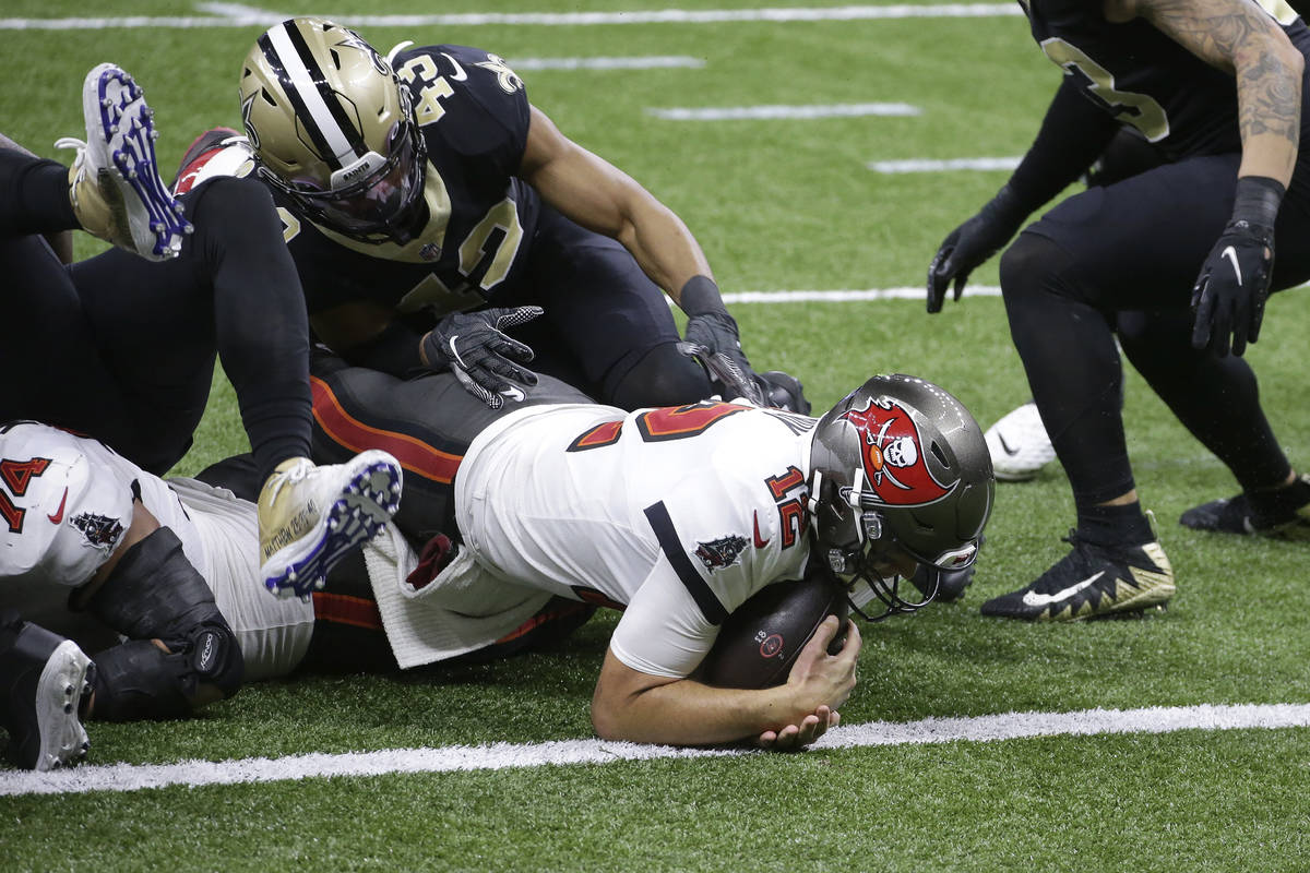 Tampa Bay Buccaneers quarterback Tom Brady (12) scores a touchdown against the New Orleans Sain ...