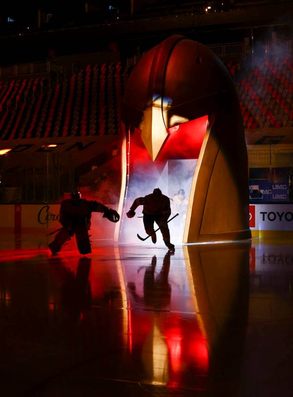 Golden Knights players skate onto the ice before taking on the Anaheim Ducks in an NHL hockey g ...