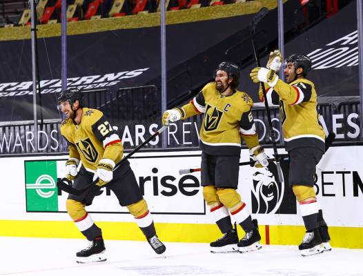 Golden Knights left wing Max Pacioretty, right, celebrates his overtime goal against the Anahei ...