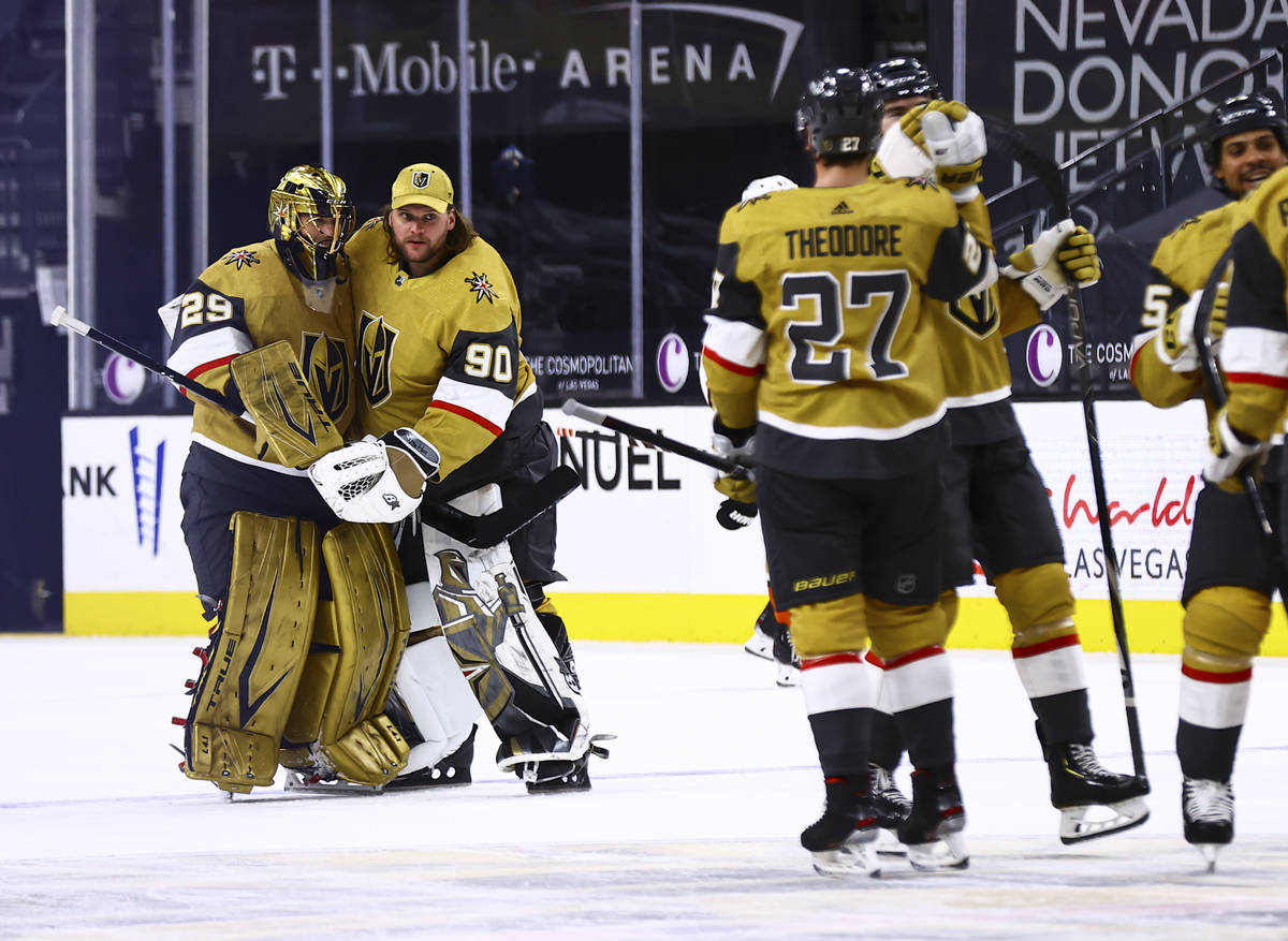 Golden Knights goaltenders Marc-Andre Fleury (29) and Robin Lehner (90) celebrate after their o ...