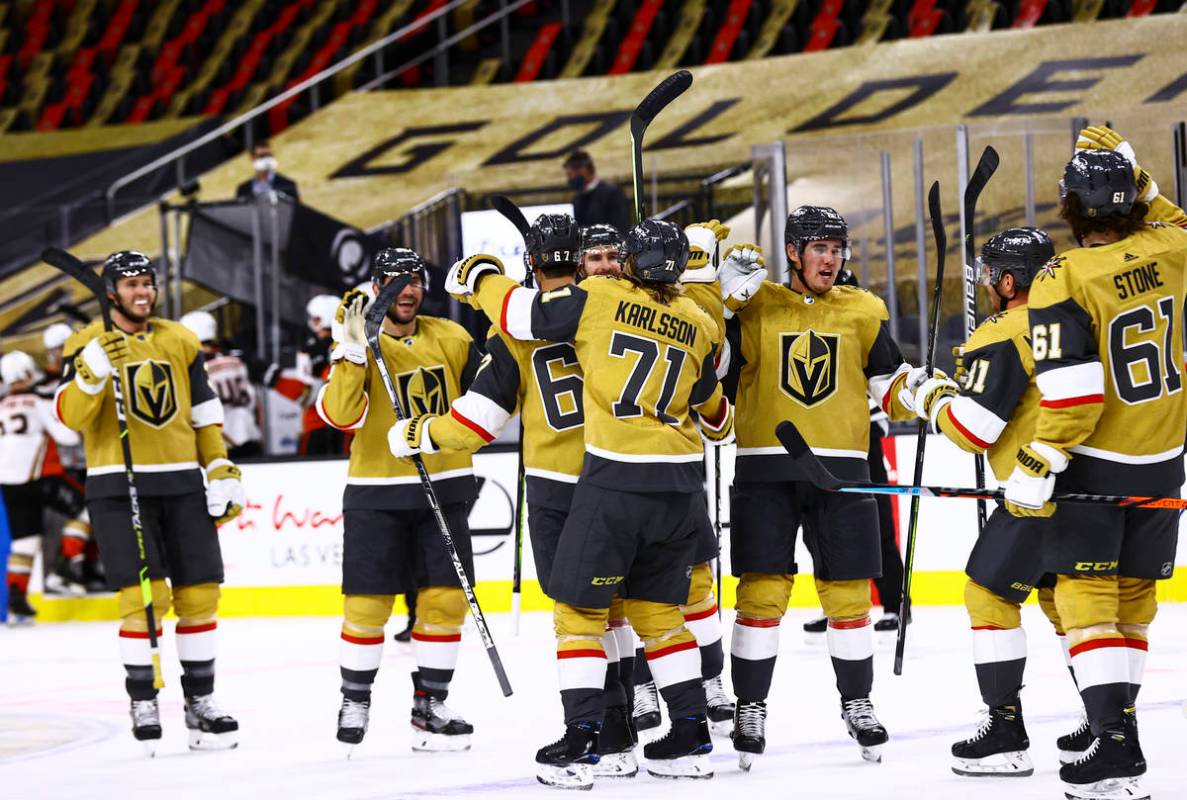 The Golden Knights celebrate after their overtime win against the Anaheim Ducks in an NHL hocke ...