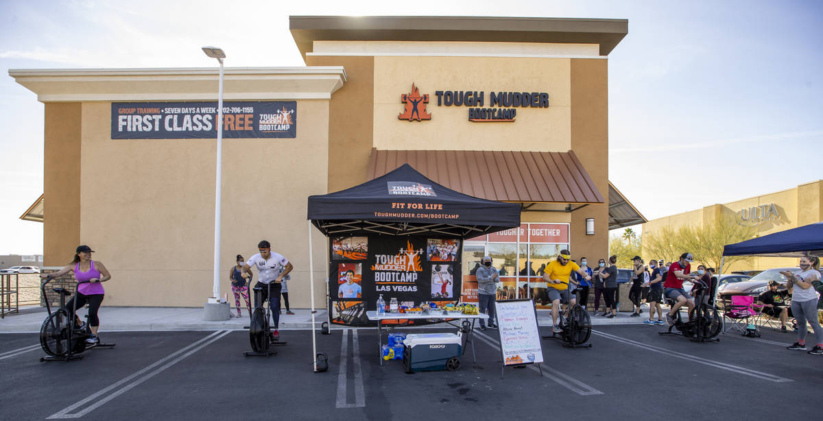 Tough Mudder Bootcamp Las Vegas members pedal 96 miles on stationary bikes as a fundraiser to t ...
