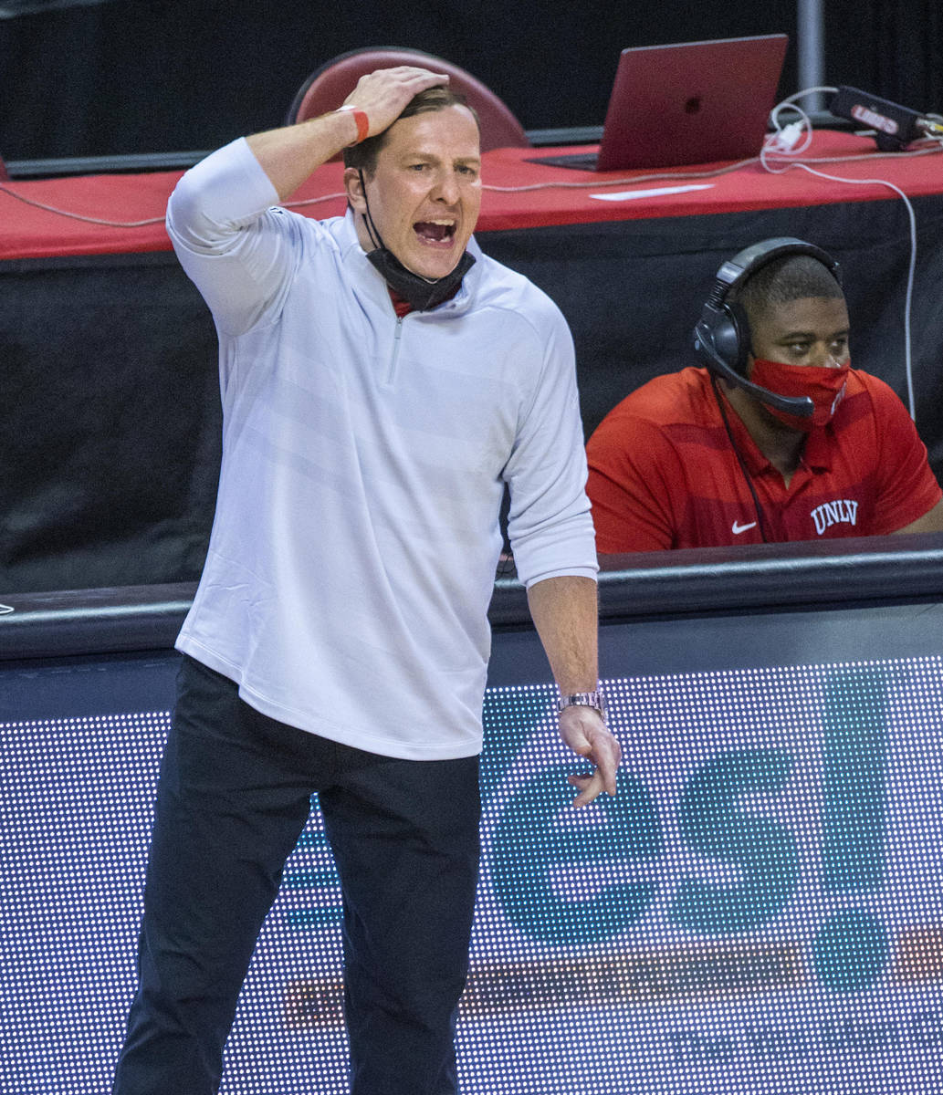 UNLV Rebels head coach T. J. Otzelberger yells a play into his players versus the New Mexico Lo ...