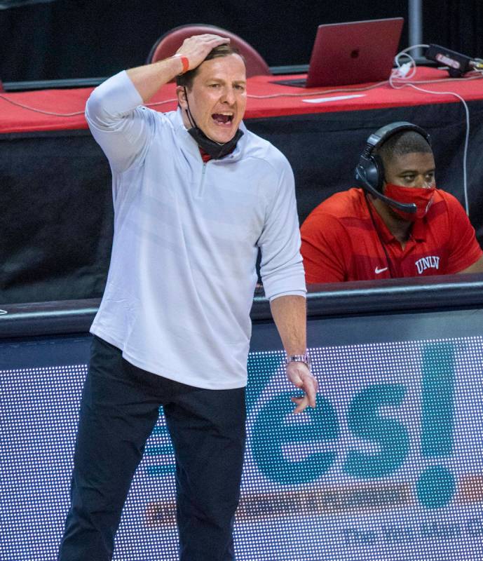 UNLV Rebels head coach T. J. Otzelberger yells a play into his players versus the New Mexico Lo ...