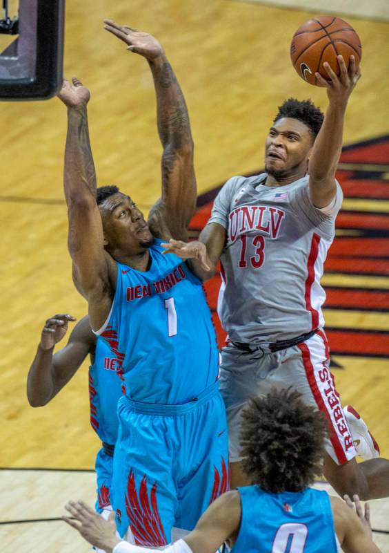 UNLV Rebels guard Bryce Hamilton (13) goes up to the net strong versus New Mexico Lobos forward ...