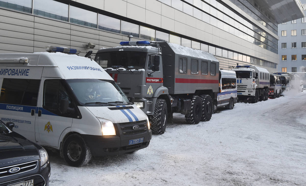 Russian Rosguardia (National Guard) and police buses stand prior to Alexei Navalny's arrival, a ...