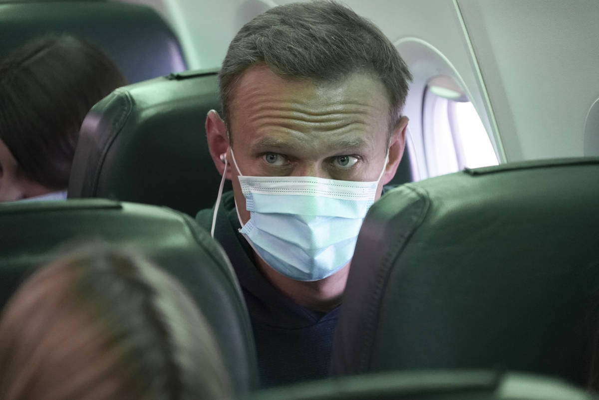 Alexei Navalny sits on the plane prior to a flight to Moscow, at the Airport Berlin Brandenburg ...