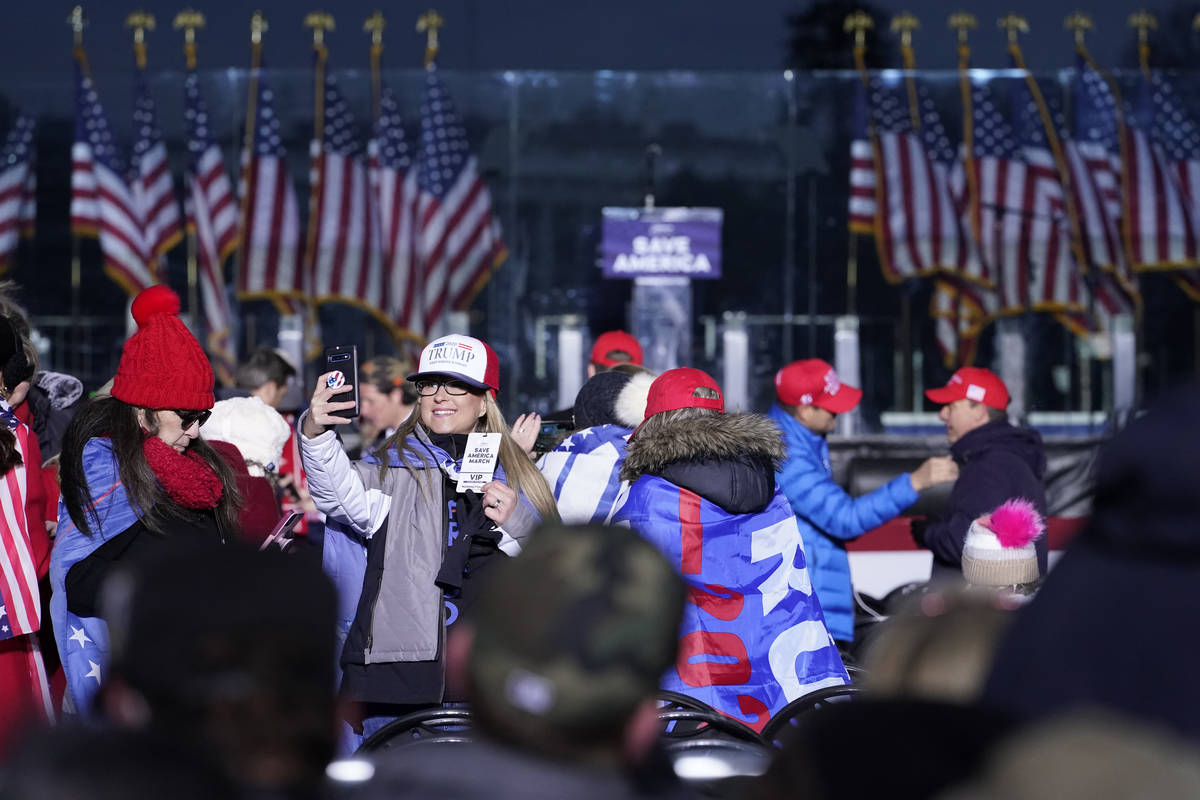 FILE - In this Jan. 6, 2021 file photo people arrive to attend a rally in support of President ...