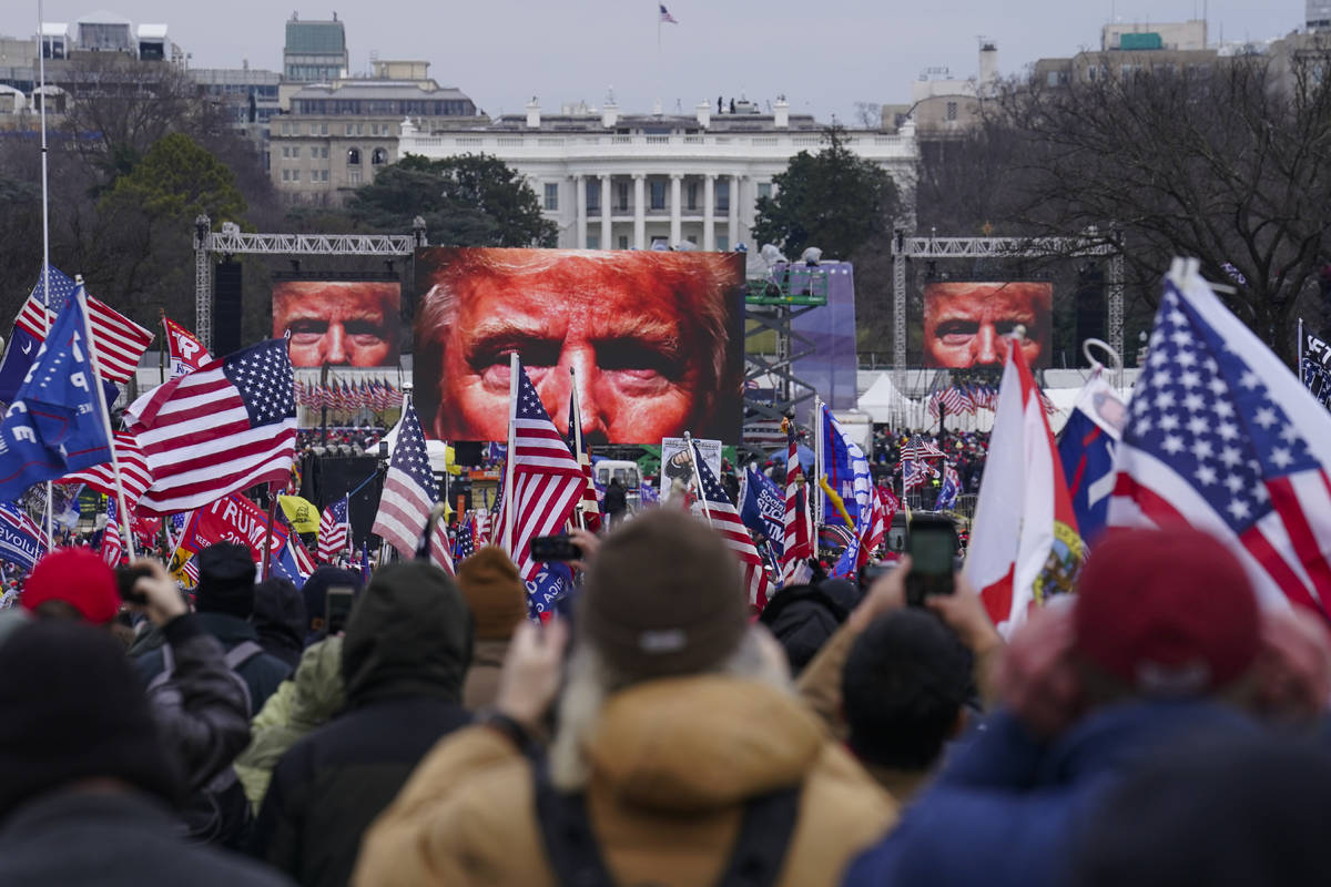 FILE - In this Jan. 6, 2021 file photo, Trump supporters participate in a rally in Washington. ...