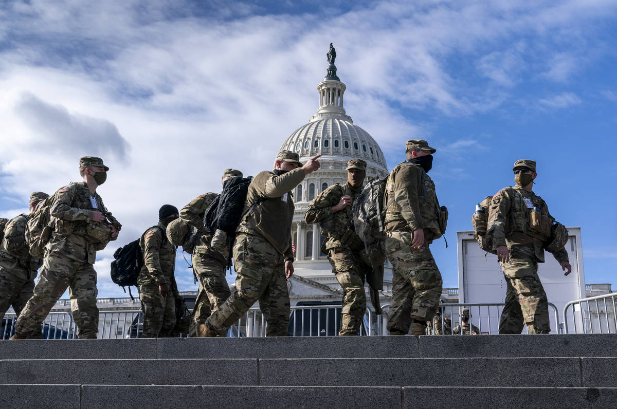 National Guard troops reinforce security around the U.S. Capitol ahead of the inauguration of P ...