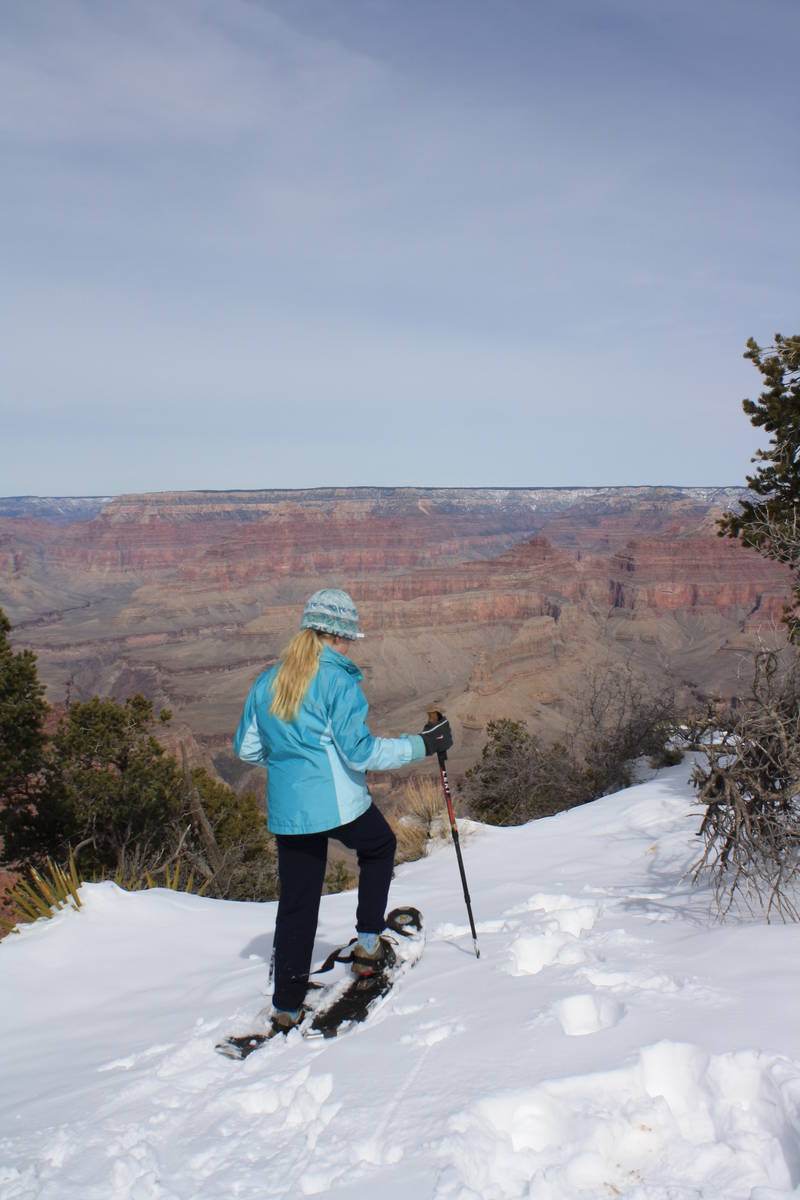 After a big snowstorm, some visitors don snowshoes to get a closer look at the canyon. (Deborah ...