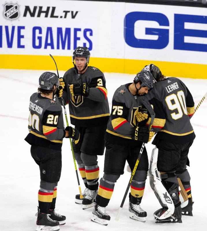 Golden Knights' right wing Ryan Reaves (75) congratulates goaltender Robin Lehner (90) after th ...